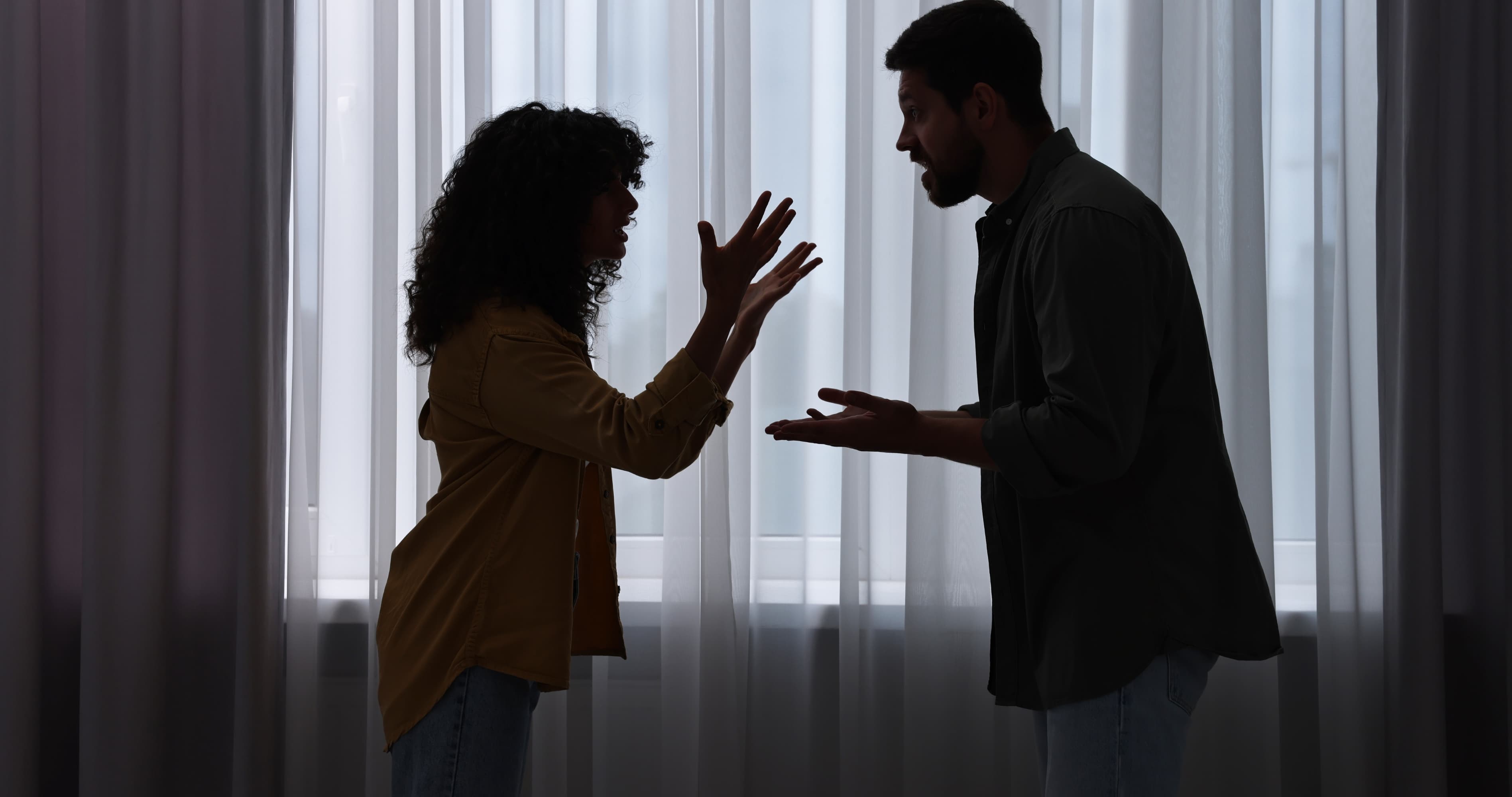 Couple arguing at home, showing relationship conflict, communication problems, and relationship mistakes to avoid.