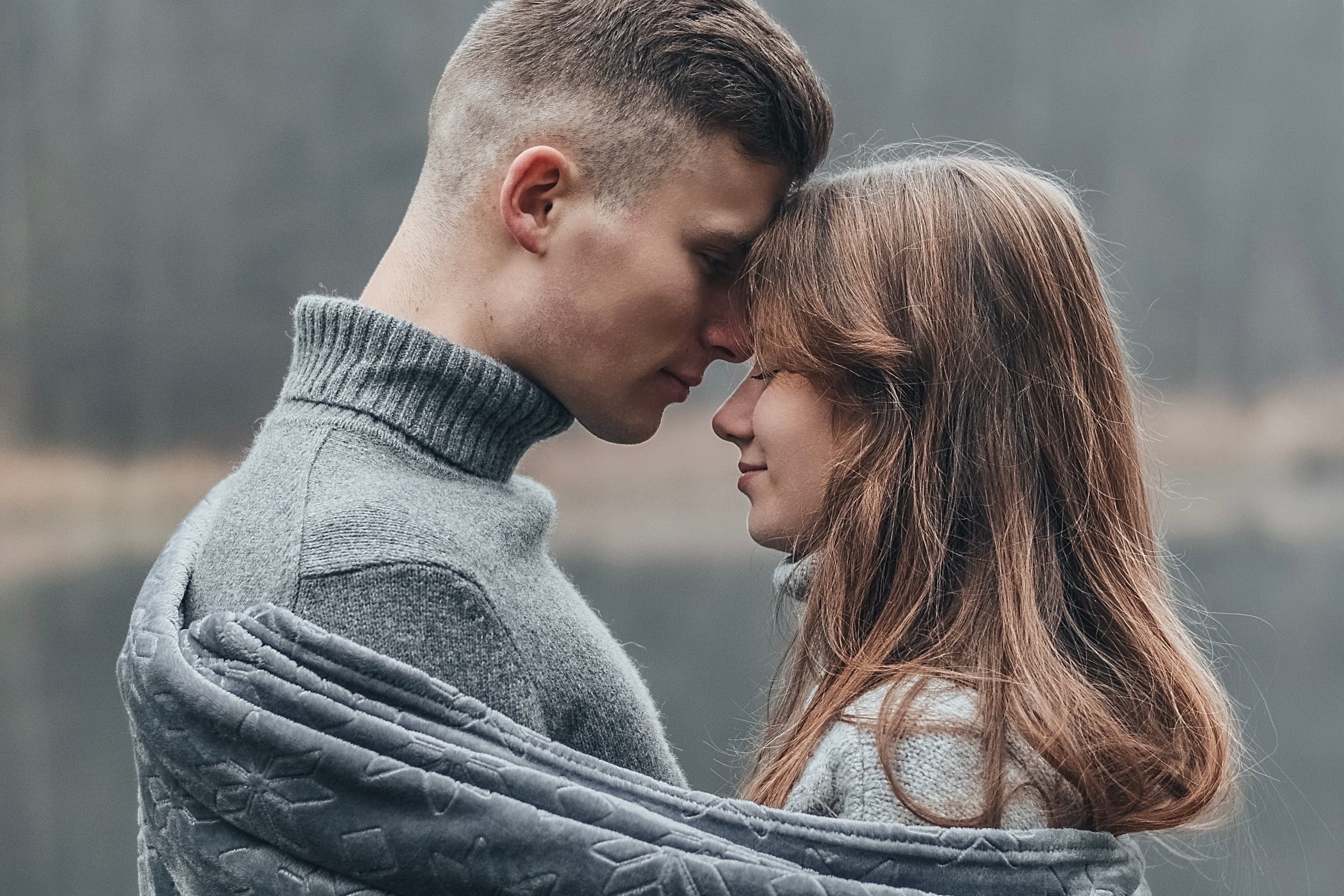 A couple sharing a quiet moment while reflecting on important questions to ask before marriage.