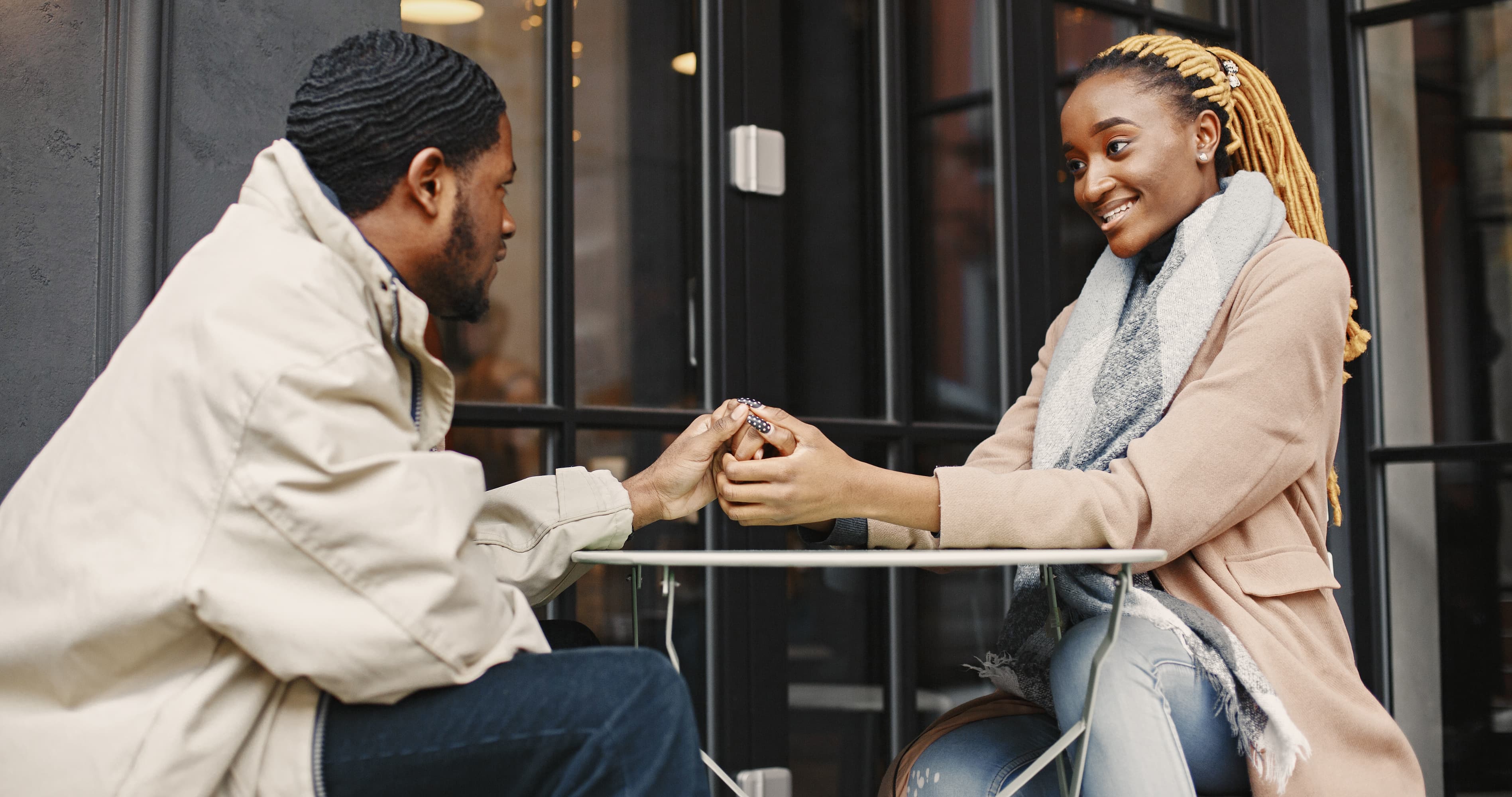 Couple holding hands during a meaningful date, showing intentional dating, emotional connection, and a purposeful relationship.